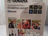the box of the yamaha bluetooth is open on the table