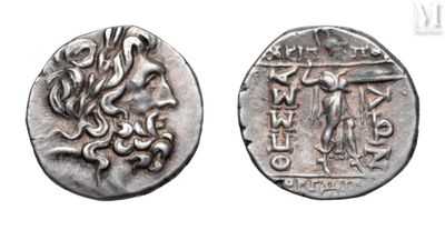 an ancient coin with a picture of a woman and a man on it