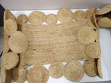 a box with a mat made out of jute