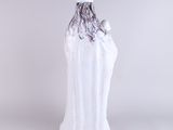 an image of a white vase with a black and white design on it