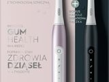 une image représentant une brosse à dents électrique avec un tube de dentifrice en arrière-plan