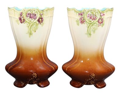 two vases with flowers painted on them on a white background
