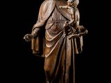 a statue of a man holding a child in his arms
