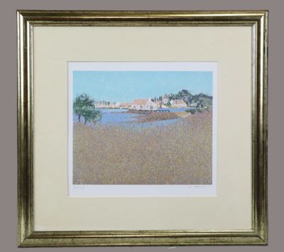 framed picture of a painting of a beach scene with a house in the distance
