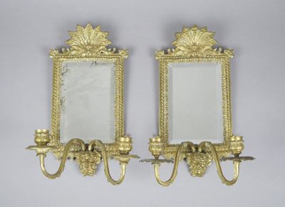 pair of antique brass wall mirrors with sconces on each side