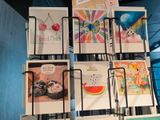 a lot of cards on display on a rack