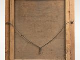 an old wooden frame with a necklace hanging from it ' s side