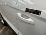 a close up of a car door handle with a sticker on it