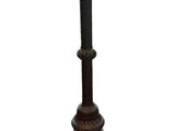 a black lamp that is on top of a wooden stand