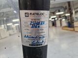 a close up of a sticker on a pole in a warehouse