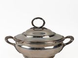a silverplated casserole dish with handles and handles
