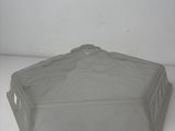 a clear plastic container with a lid on a white surface