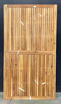 a tall wooden screen with white arrows on it