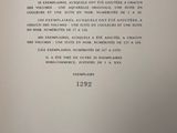 an open book with a black and white image of a clock on it