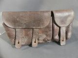 a brown leather bag that is sitting on a table