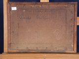 an old painting is sitting on top of a wooden easel