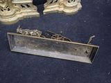 pair of antique brass candlesticks with a horse and carriage design