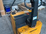 a forklift that is sitting in a garage