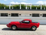 a red car that is parked in front of a building