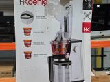 une boîte contenant un extracteur de jus posée sur une table