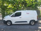 a white van that is parked in the parking lot