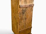 a wooden cabinet with a door on top of it