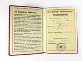 an old german passport with a german flag on it