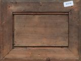 an old wooden picture frame with a label on it