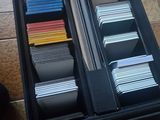 a drawer full of files on a tiled floor