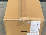 a cardboard box that is sitting on the ground