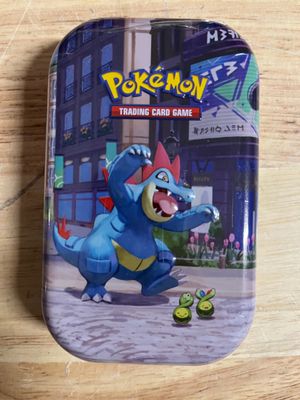 pokemon trading card game tin with a blue and yellow pokemon character on it