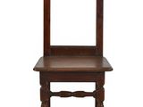an old wooden chair with a mirror on top of it