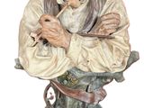a statue of an old man with a hat on his head