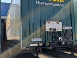 a truck that is parked in front of a building