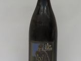 a bottle of wine that is sitting on a table