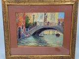 une peinture à l'huile représentant un pont au-dessus d'une rivière, dans un cadre doré