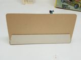 a small toy car sitting on top of a cardboard box