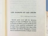 an open book with a picture of a cat on it