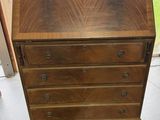 an old wooden desk with drawers and drawers on it