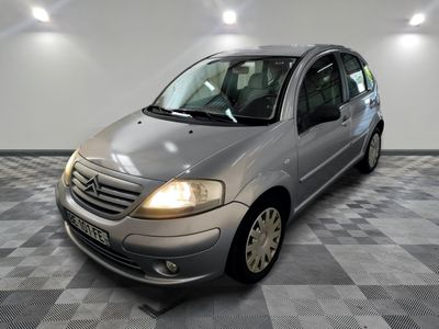 a picture of a silver car parked in a garage