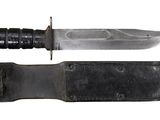 a knife that is laying on top of a knife sheath