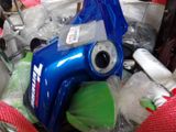 a blue blow dryer sitting on top of a pile of other items
