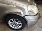 an image of a car that has been badly repaired