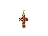 a gold cross pendant with red and white diamonds on a white background