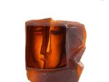 a glass sculpture of a face inside of a box