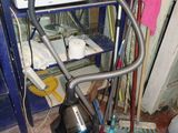 an image of a kitchen with a microwave on a stand