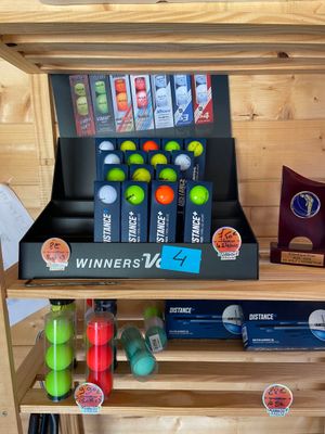 a shelf with various items on it in a store