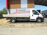 a white truck that is parked in front of a building