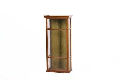 a tall wooden display case with a glass door