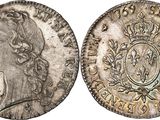 a silver coin with a crown on the front and a crown on the back